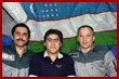  Vinogradov, Sharipov and Solovyev float before an Uzbeck flag hanging on the Base Block 